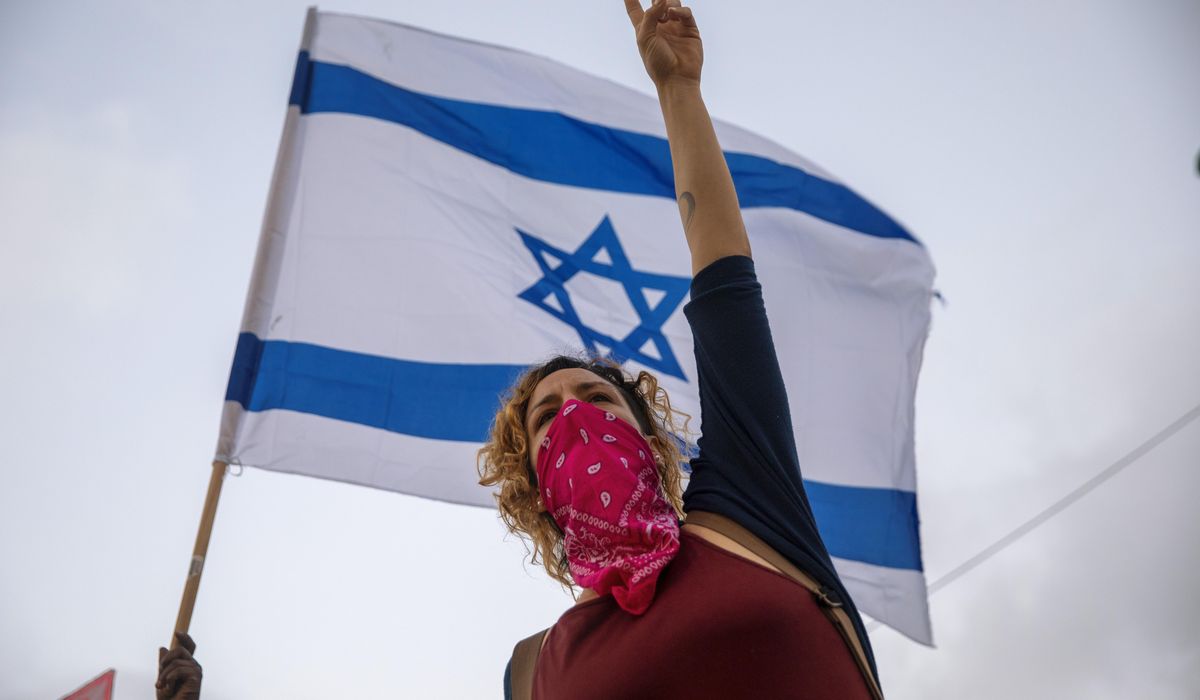 Israel approves law to curb protests during virus
lockdown 1
