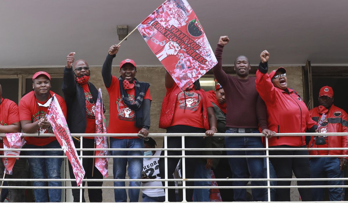 South African healthcare workers protest, threaten
strike 1