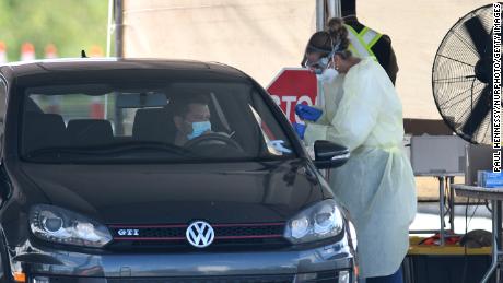 Wisconsin judge upholds mask mandate as Covid cases
surge 1