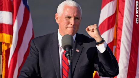 Pence's office says he did not attend swearing-in due to CDC
guidelines 1