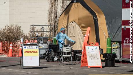 Nearly 50,000 Americans are hospitalized with coronavirus as
experts warn of growing healthcare pressure 1