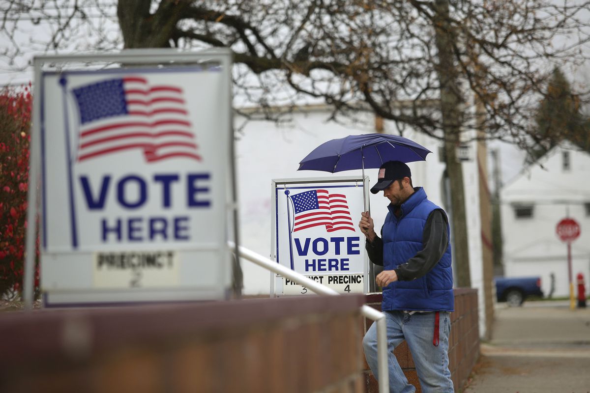 Michigan bans open carry of guns within 100 feet of voting
locations on Election Day 1 Michigan bans open carry of guns within 100 feet of voting
locations on Election Day 1