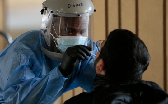 Coronavirus updates: COVID surges as third of US states set
records for new cases; Johnson & Johnson pauses vaccine
trial 1
