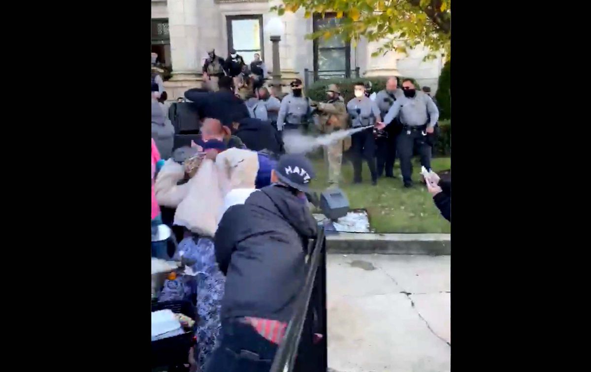 Police pepper-spray protesters for kneeling in road in North
Carolina 1