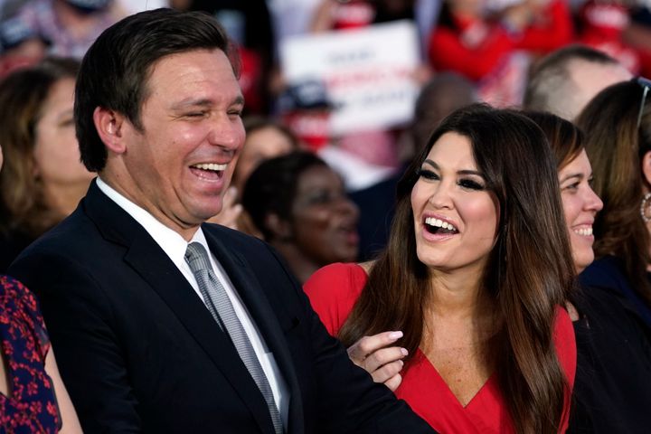 Viral Video Shows Maskless Florida Gov High-Fiving Trump
Fans, Then Rubbing His Nose 1