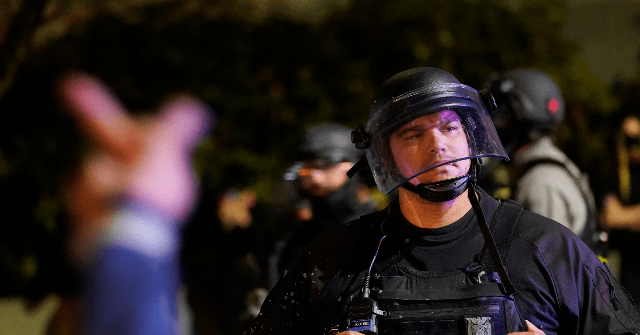 Portland Protesters Gather to Honor Man Who Shot Two Men,
Pointed a Gun at Police 1