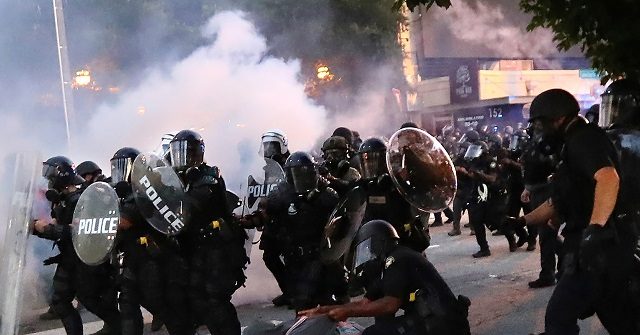 Watch: DC Cops Respond to Violent Protesters with Tear Gas,
Flash Bangs 1