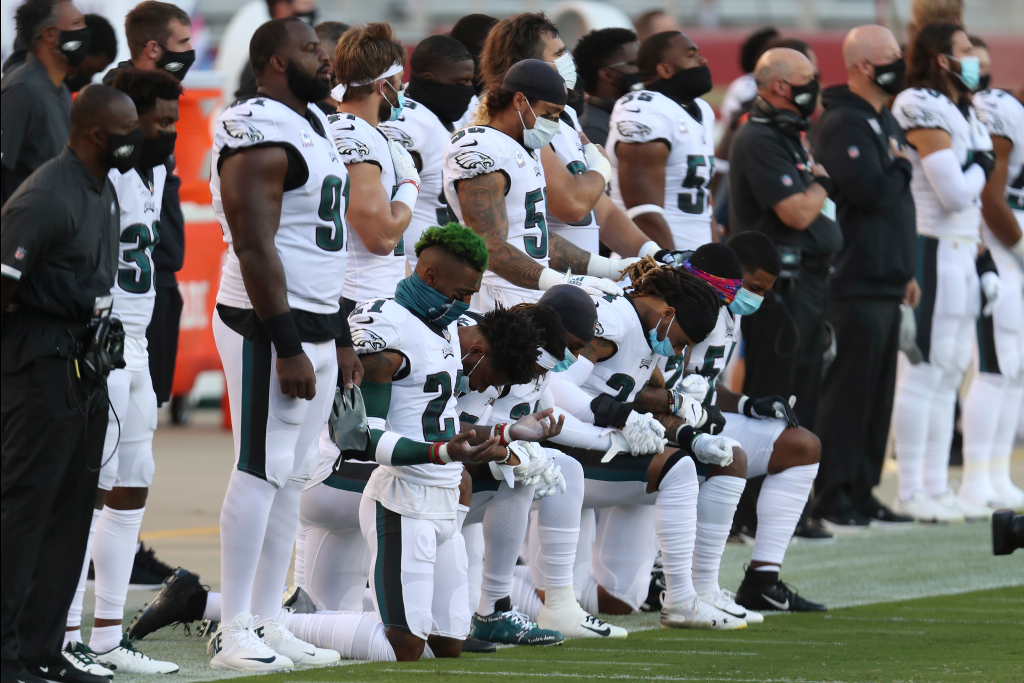 Several 49ers, Eagles players demonstrate during anthem to
protest police violence 1