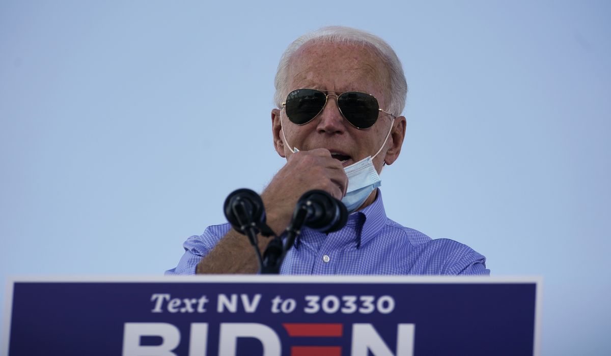 Joe Biden razzed after pulling down mask to cough into
hand 1