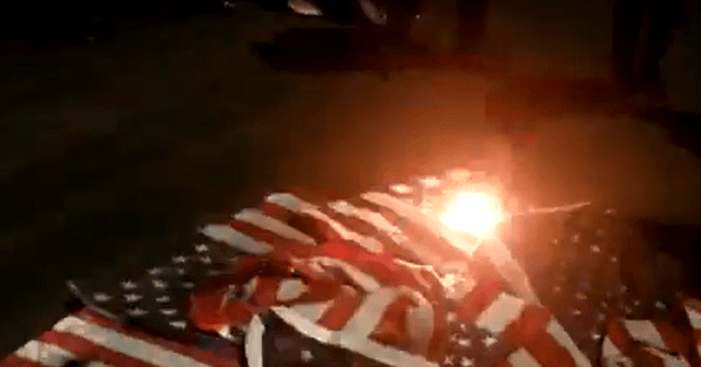 Report: NY Rioters Burn American Flags Stolen from
Homes 1