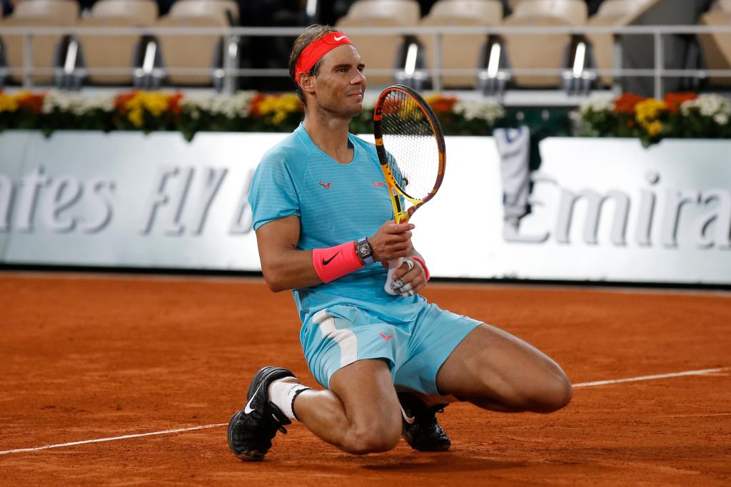 Perfect in Paris, Rafael Nadal overwhelms Novak Djokovic at
French Open to tie Roger Federer 1