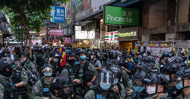 Hong Kong Police Make Dozens of Arrests amid Mass Defiance
of Protest Ban 1