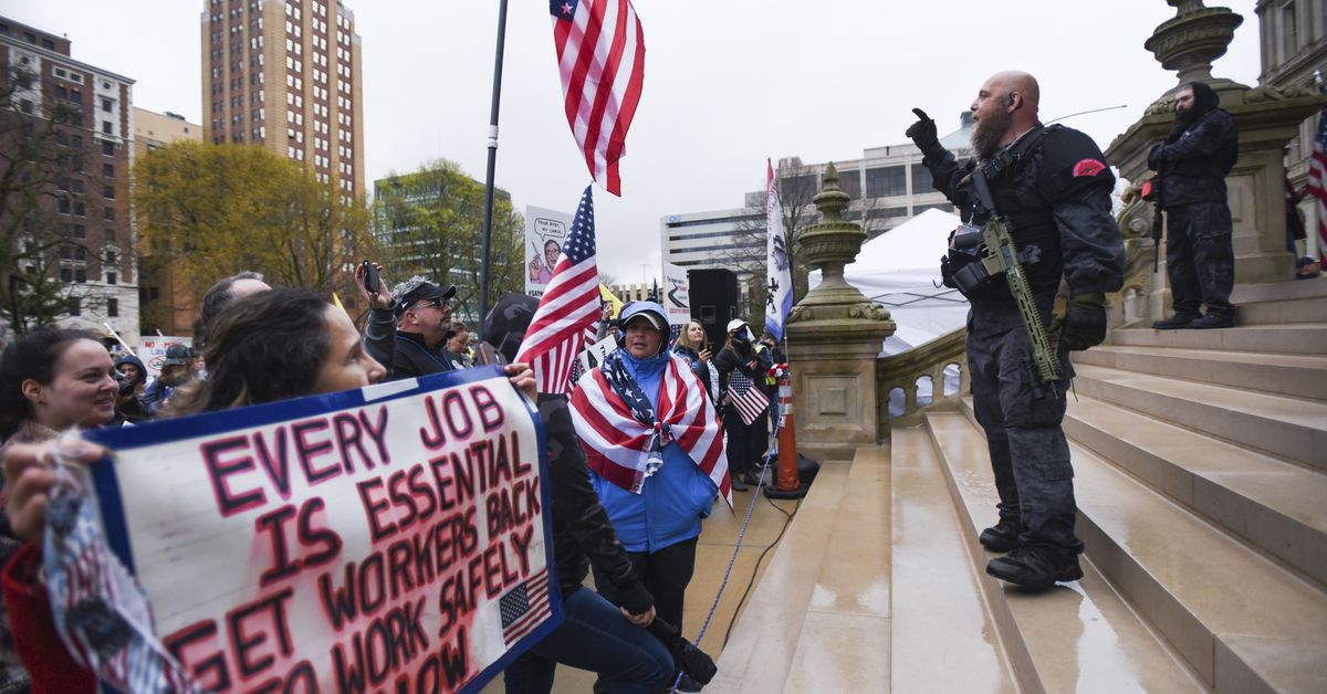 Men accused in plot on Michigan governor among armed
protestors who rallied at the Michigan Capitol 1