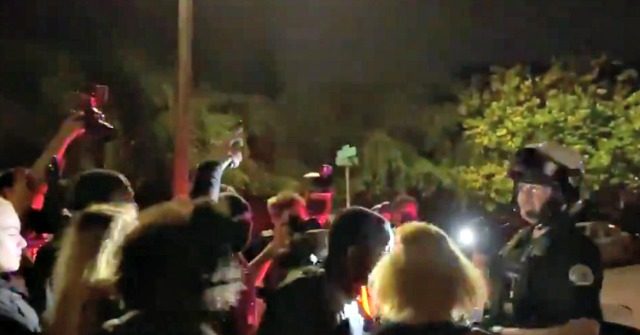 Officers Arrest Four in 'Hostile Crowd' at Portland
Protest 1