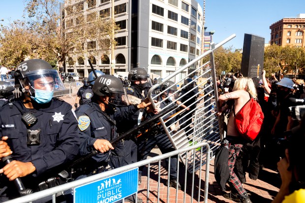 Three police officers injured as protesters clash with Trump
supporters in San Francisco 1