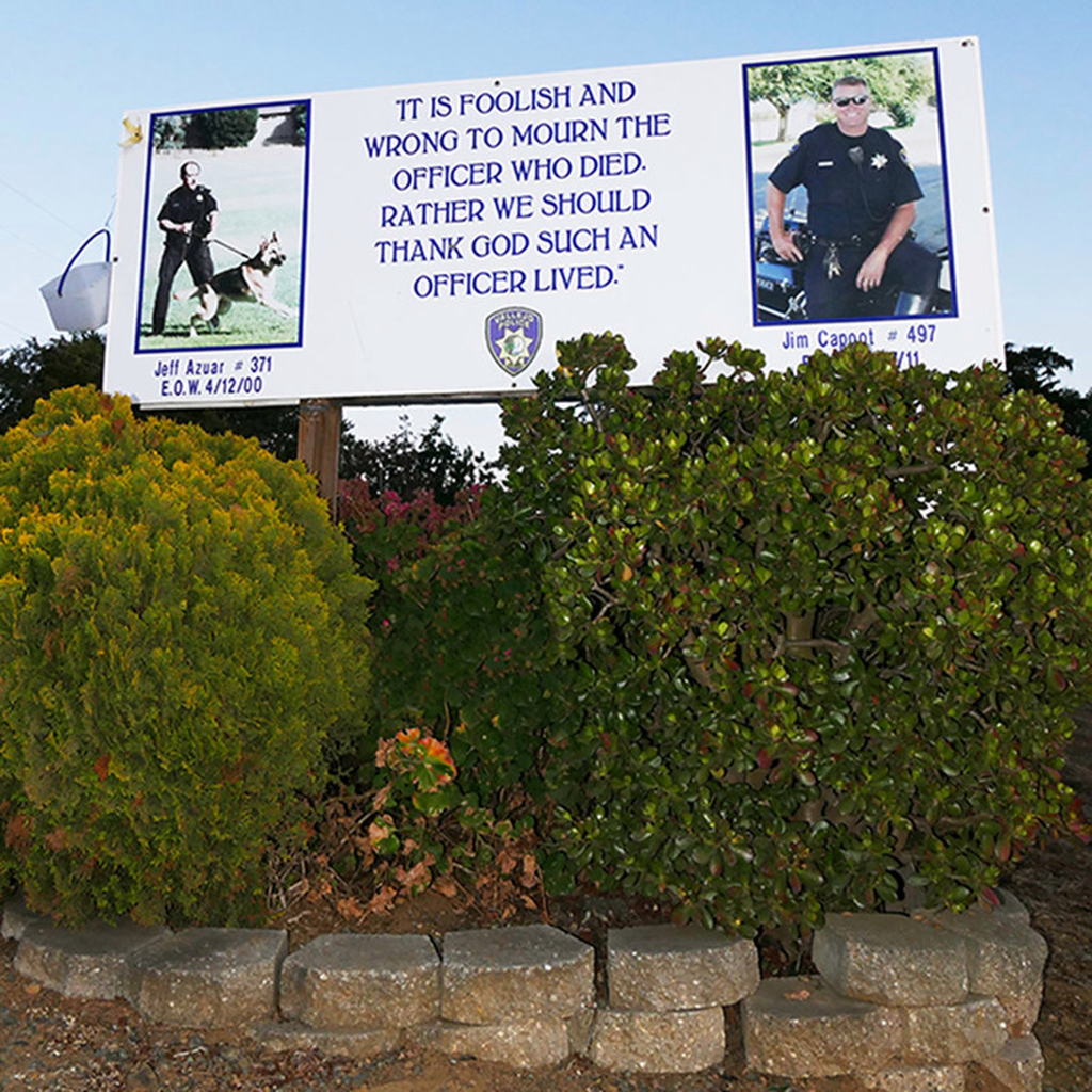 Vandal trashes memorial signs honoring two fallen Vallejo
police officers 1