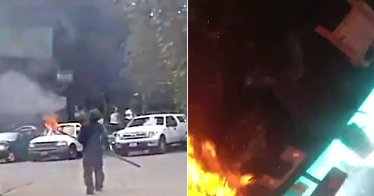 Man with Torch Charges Officer, Sets Fire to Patrol Car with
Cop Inside 1