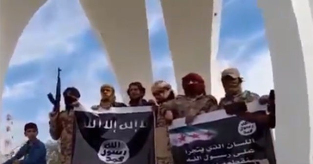 Reports: Syrians Wave Islamic State Flags to Protest French
Cartoons 1