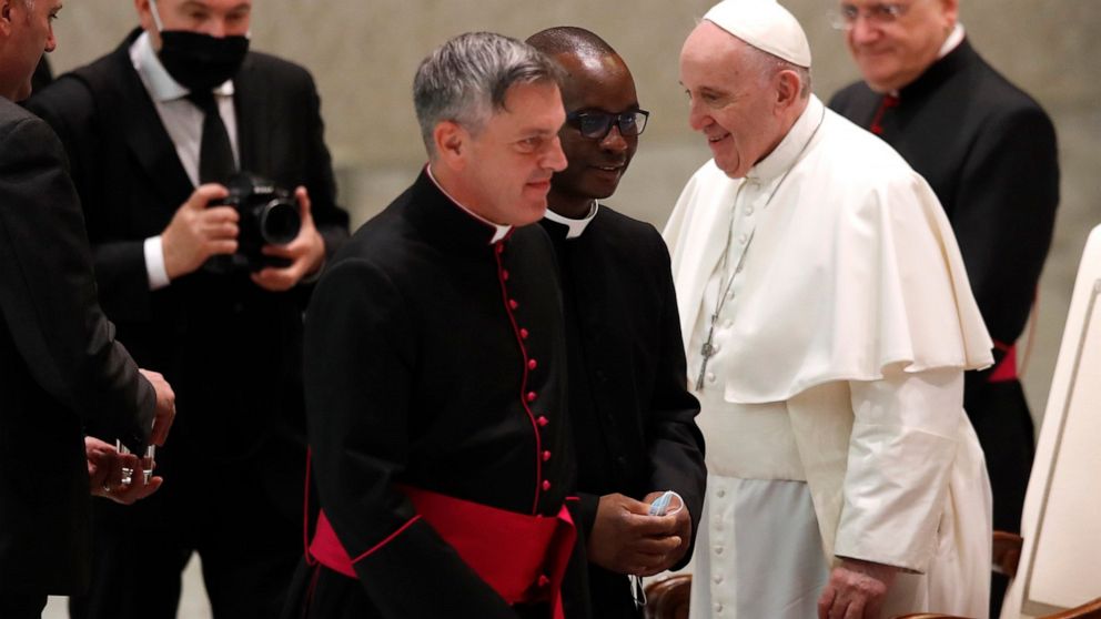 Maskless pope blames 'this lady called COVID' for
distance 1