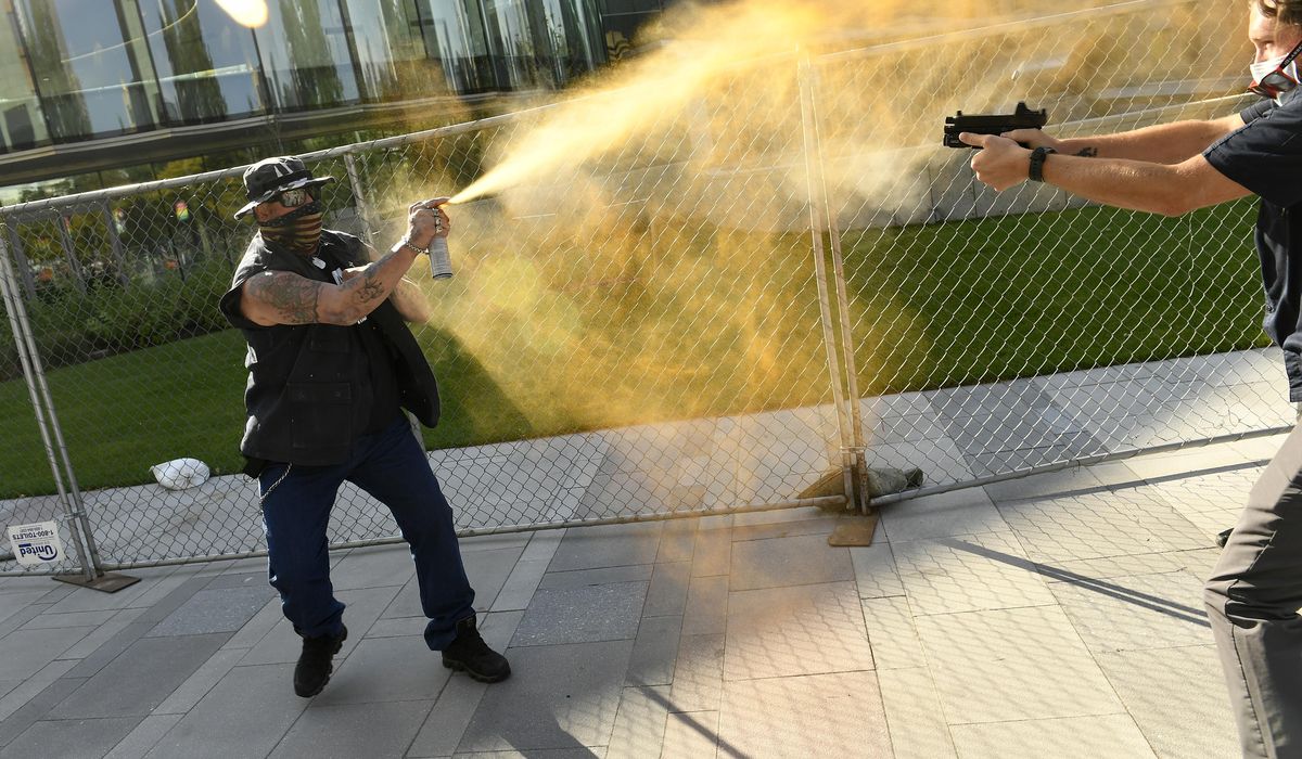 Guard in custody over fatal shooting at Denver
protests 1