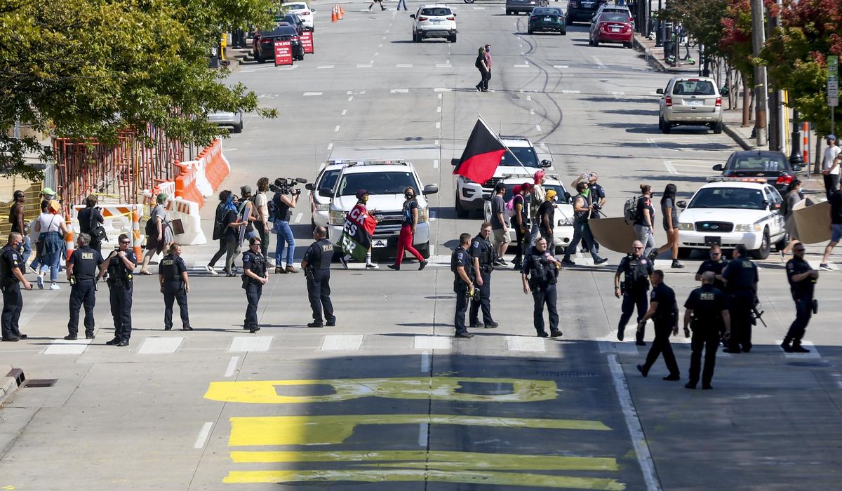 Protestors paint BLM after City of Tulsa removes street
sign 1