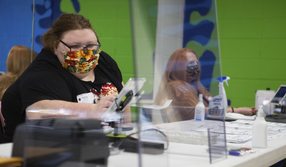 Kansas counties make their own rules on poll worker
masks 1