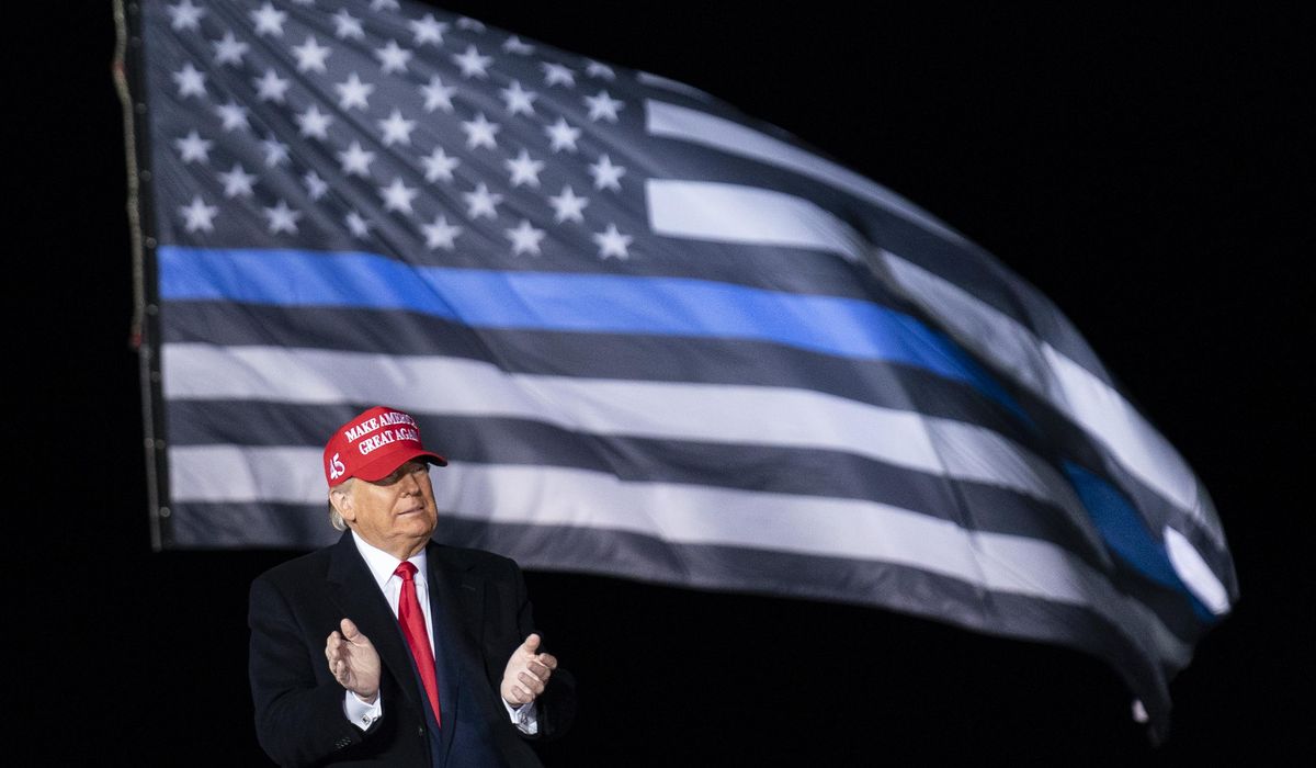 Trump, in Wisconsin, warns supporters that Biden and Harris
will 'appease' rioters 1