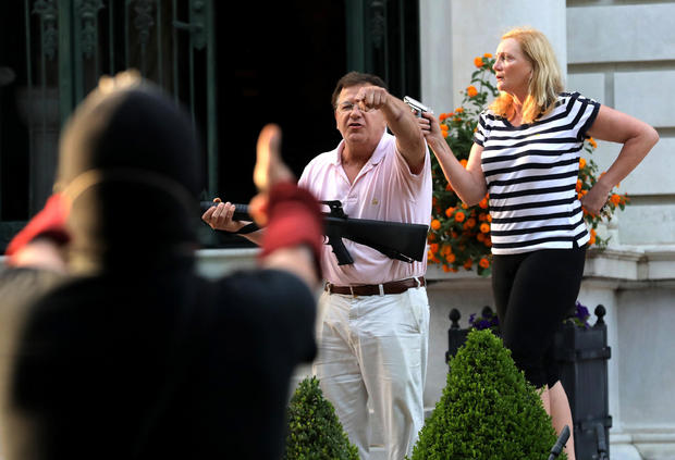 Couple who pointed guns at protesters plead not
guilty 1