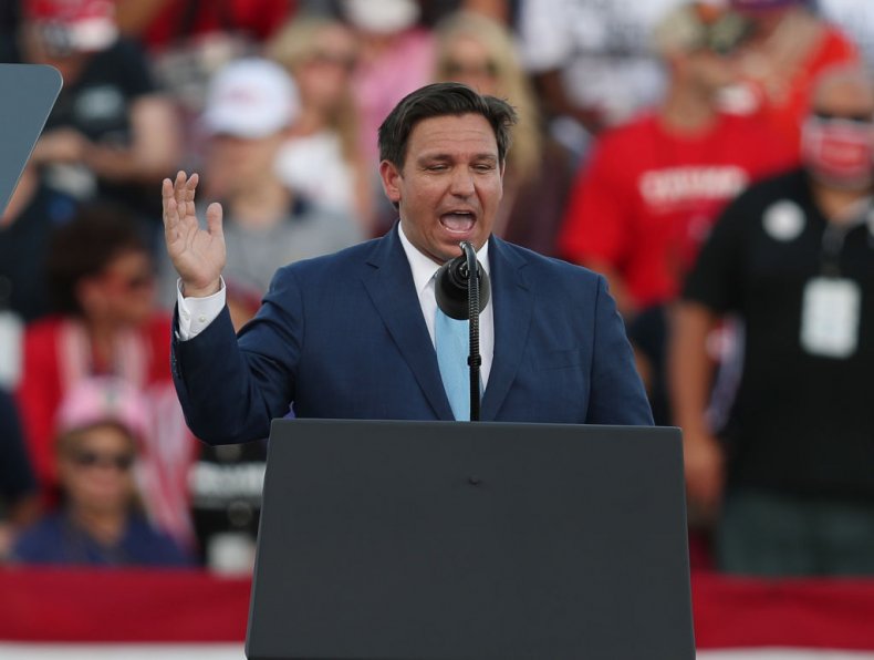 Maskless Ron DeSantis High-Fives Trump Supporters at Packed
Florida Rally 1