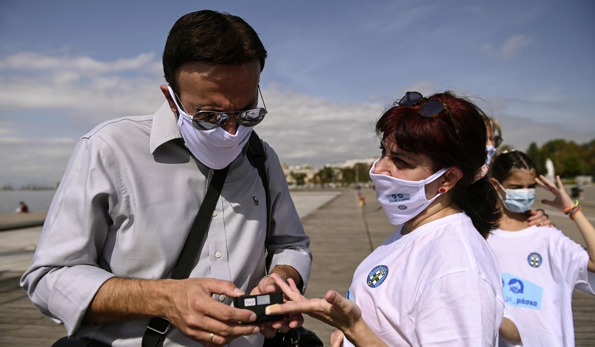 Greek doctors march and measure to promote use of face
masks 1