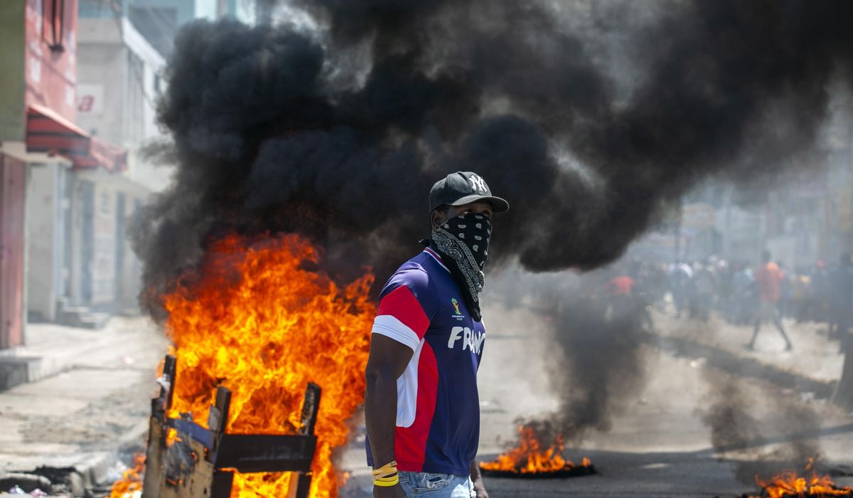 Haitian police, protesters clash; president calls for
unity 1