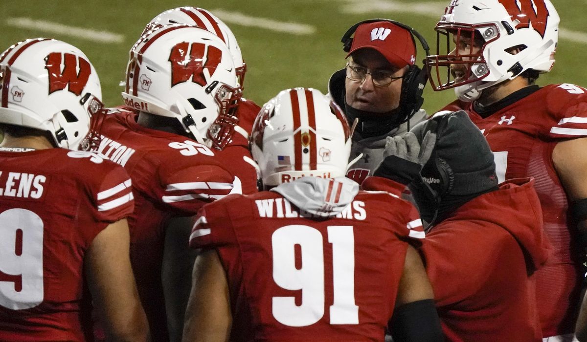 No. 10 Wisconsin says it's down to 14 active COVID-19
cases 1
