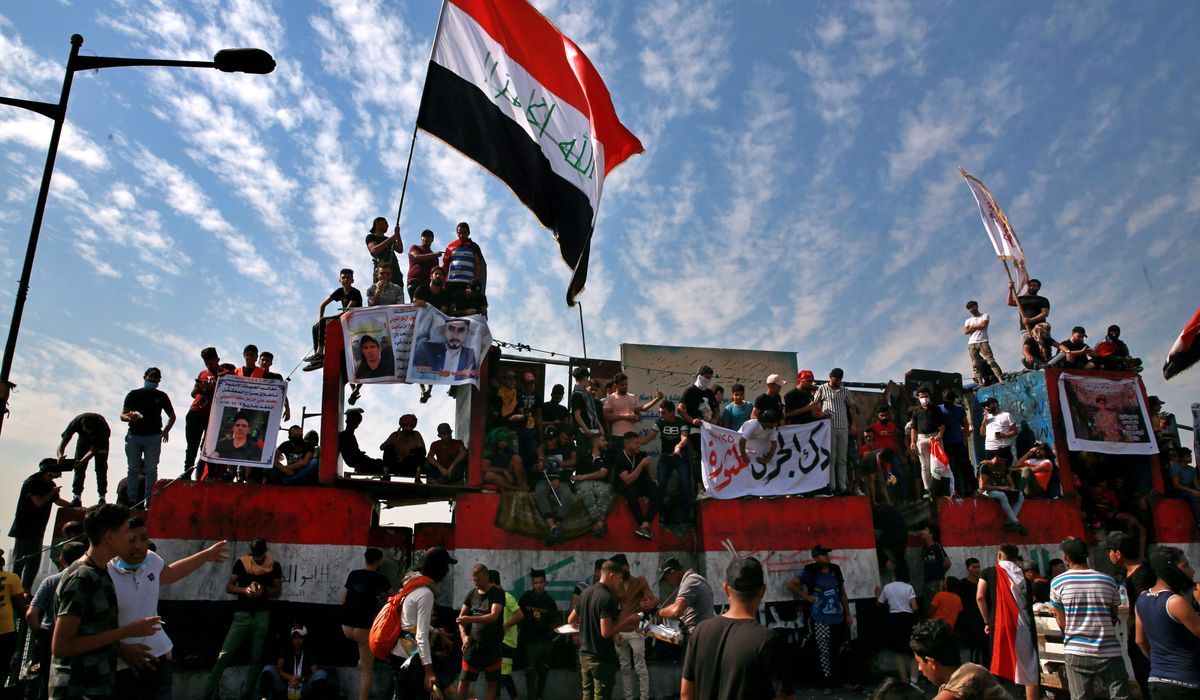 Thousands rally in Iraq to mark one year of protests 1
