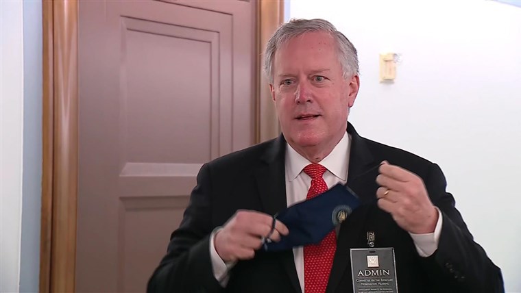 Trump chief of staff Mark Meadows refuses to speak to
reporters with mask on 1