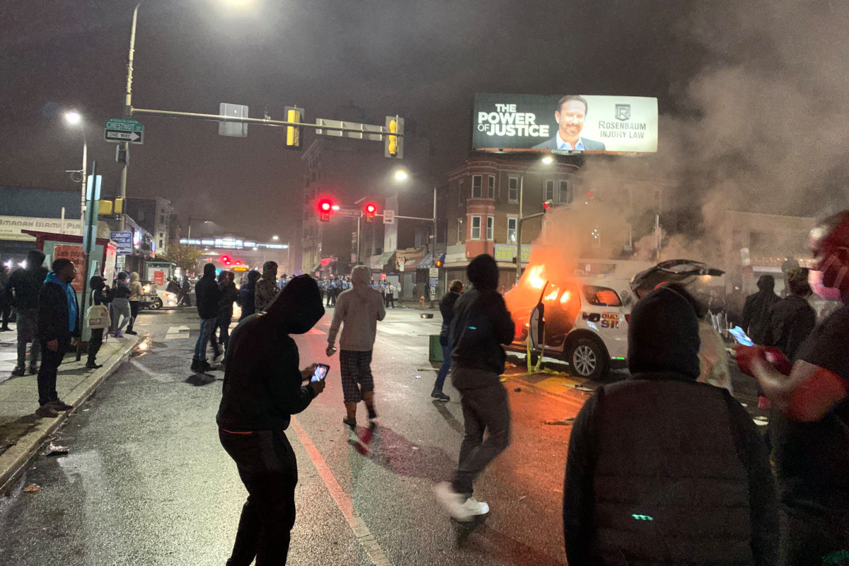 Philadelphia cop hit by truck amid protests over police
shooting 1