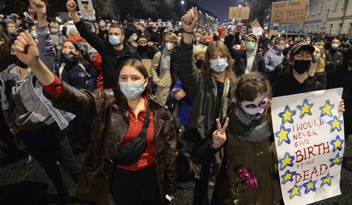 Polish women protest new abortion restriction in
churches 1