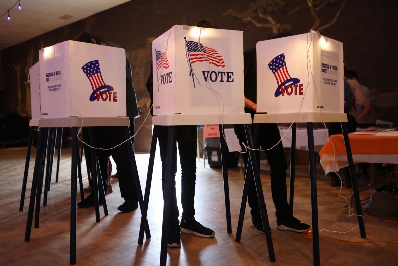 Poll Workers in Texas County Could Face $1,000 Fine if They
Turn Away Unmasked Voters 1