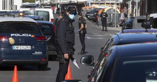 Madrid Starts Partial Lockdown, Police Control Travel in and
out of Spanish Capital 1