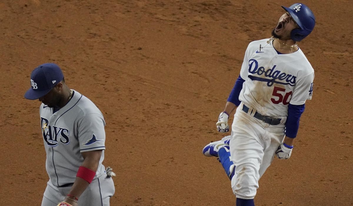 Fitting finale: Dodgers win title, lose Turner to
COVID-19 1