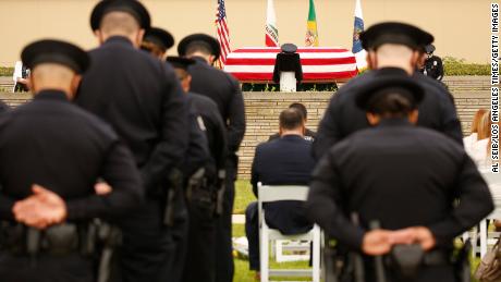 Houston police officer killed while responding to a call for
help on his way to work 1
