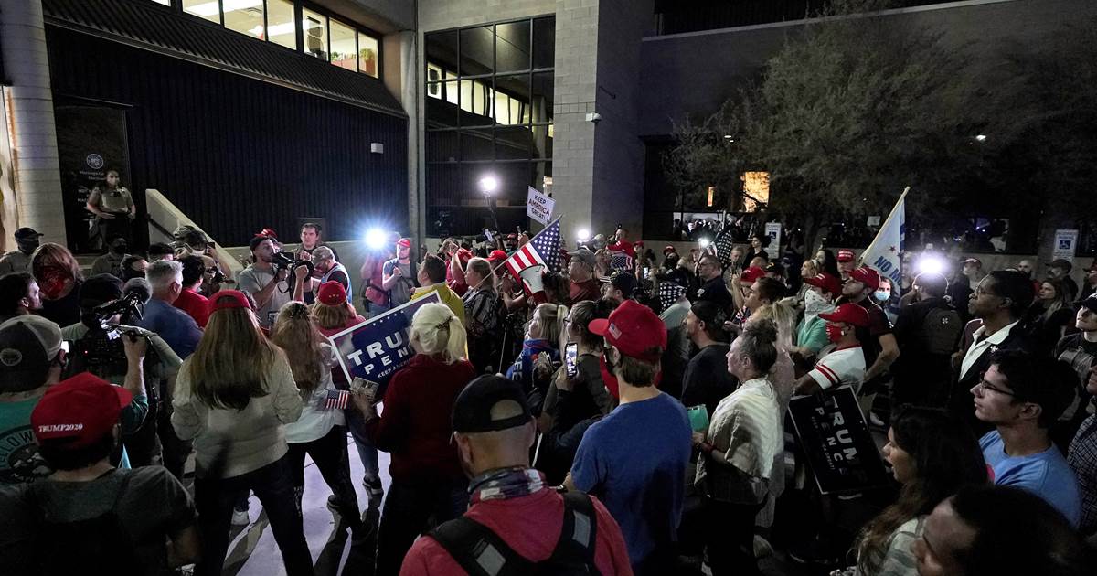 Chanting 'count the votes,' pro-Trump protesters gather
outside Arizona counting center 1