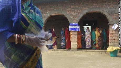 Modi declares victory in India's first coronavirus election
as cases soar in country's capital 1