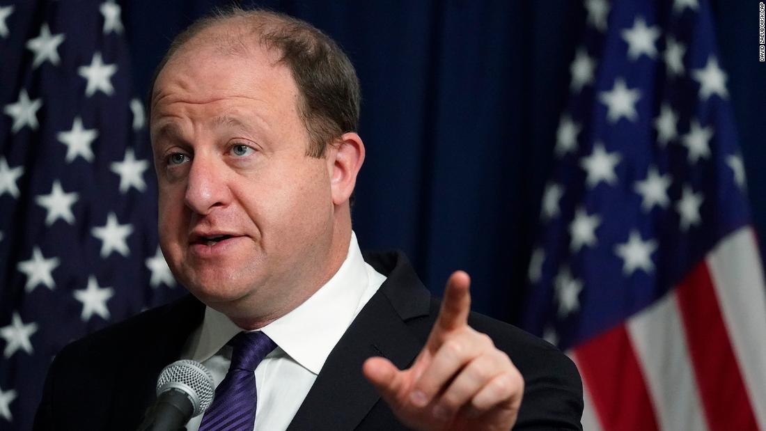 Colorado governor and spouse test positive for
Covid-19 1