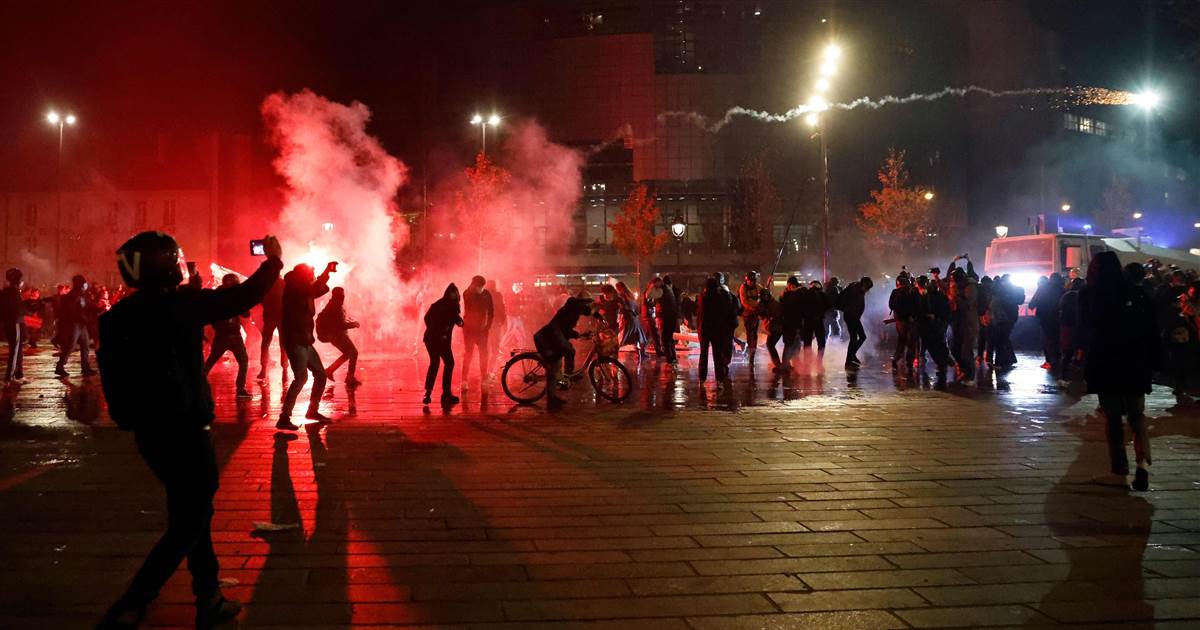 Protesters clash with police at Paris protest against police
violence 1