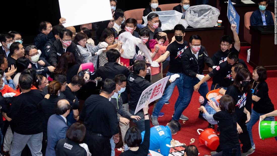 Taiwan lawmakers throw pig guts in protest over meat
imports 1