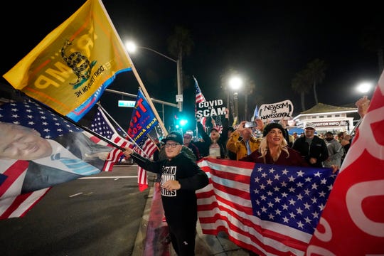 In CA: Anti-curfew event draws maskless protestors, and L.A.
suspends outdoor dining 1