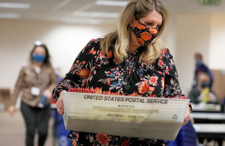 USPS Says COVID-19 Is Delaying Ballot Delivery In Swing
States 1