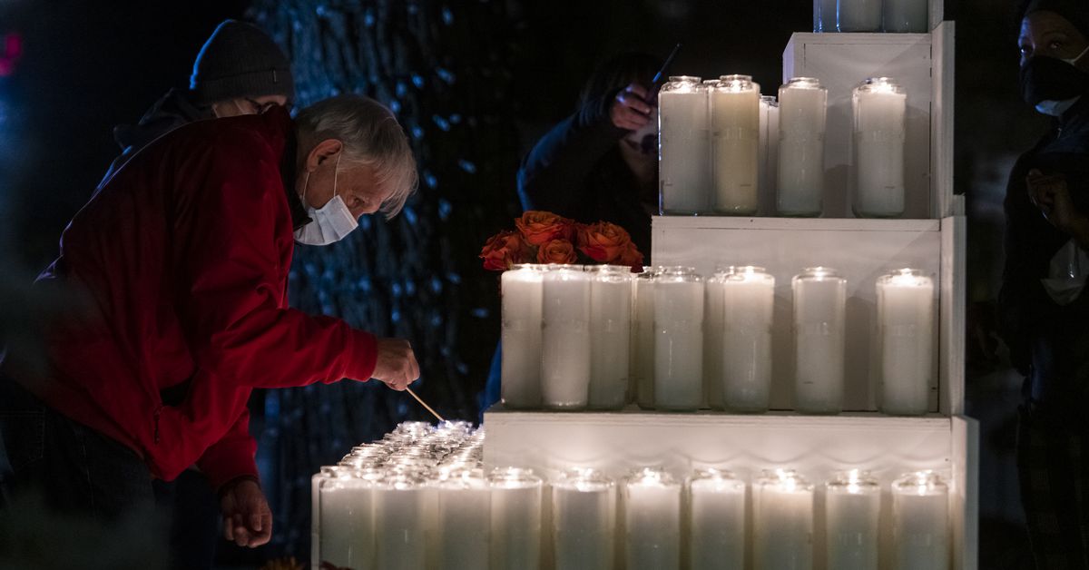 231 candles lit outside North Side church — each
representing 1,000 COVID-19 deaths in U.S. 1