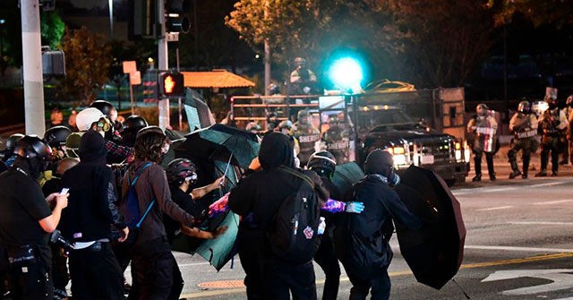 REPORT: 'Pigs Are Pigs, We F*ck Your Wife," Protesters Shout
at LA Cops 1