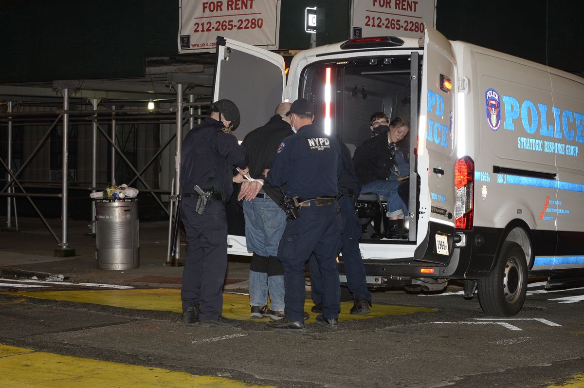 Cops make 57 arrests, including woman they say punched NYPD
chief, during wild Manhattan election protest 1